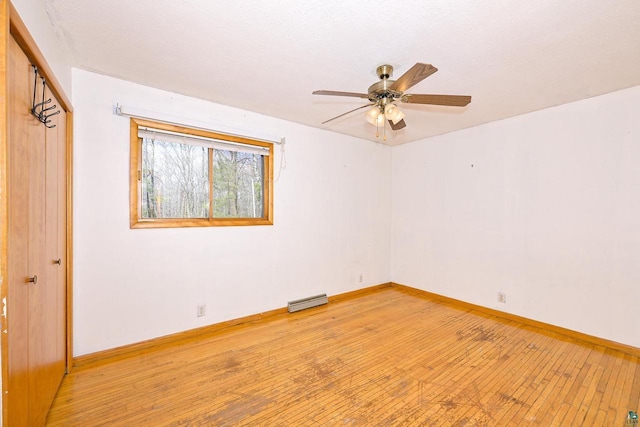7113 E County Rd E, South Range, WI 54874 - unfurnished room featuring light wood-type flooring, a ceiling fan, and baseboards
