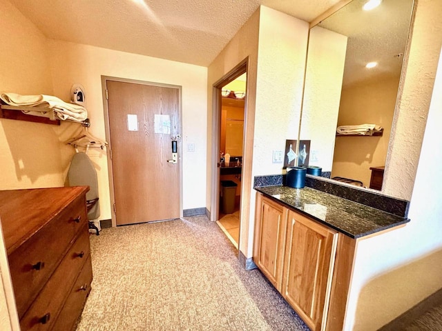 2504 River Rd Unit 7218, Wisconsin Dells, WI 53965 - hallway with light colored carpet and a textured ceiling