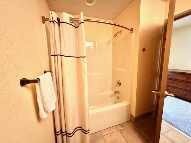 2504 River Rd Unit 7218, Wisconsin Dells, WI 53965 - bathroom featuring tile patterned floors, a textured wall, and shower / bathtub combination with curtain