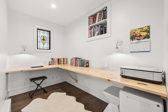 175 Old Wausau Rd, Stevens Point, WI 54481 - office area featuring built in desk, dark wood-type flooring, and baseboards