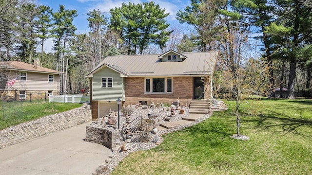 175 Old Wausau Rd, Stevens Point, WI 54481 - view of front facade featuring concrete driveway, a standing seam roof, metal roof, and an attached garage