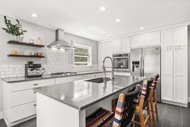 175 Old Wausau Rd, Stevens Point, WI 54481 - kitchen with stainless steel appliances, wall chimney range hood, a sink, dark tile patterned flooring, and backsplash