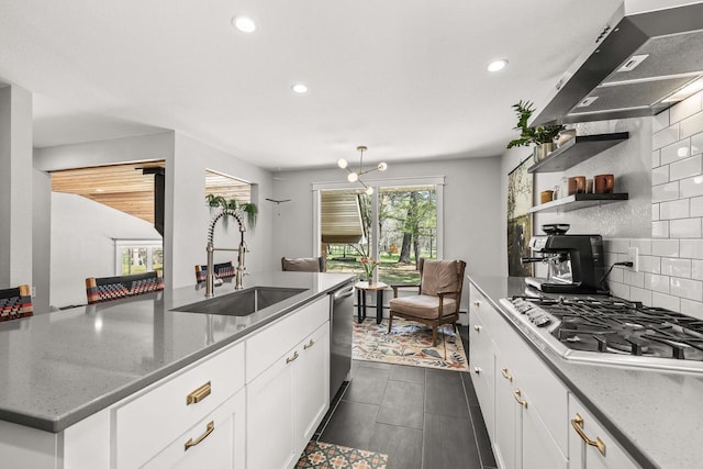 175 Old Wausau Rd, Stevens Point, WI 54481 - kitchen with a sink, stainless steel appliances, ventilation hood, backsplash, and recessed lighting