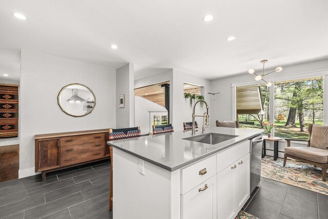 175 Old Wausau Rd, Stevens Point, WI 54481 - kitchen featuring a sink, a kitchen island with sink, recessed lighting, white cabinetry, and hanging light fixtures