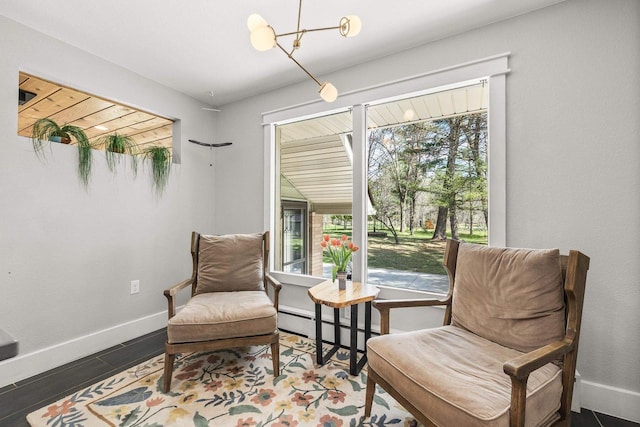 175 Old Wausau Rd, Stevens Point, WI 54481 - sitting room featuring baseboard heating, baseboards, and a chandelier