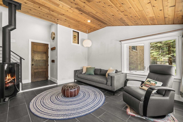 175 Old Wausau Rd, Stevens Point, WI 54481 - tiled living room with vaulted ceiling, a wood stove, and wood ceiling