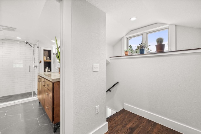 175 Old Wausau Rd, Stevens Point, WI 54481 - hallway with lofted ceiling, a textured wall, an upstairs landing, baseboards, and recessed lighting