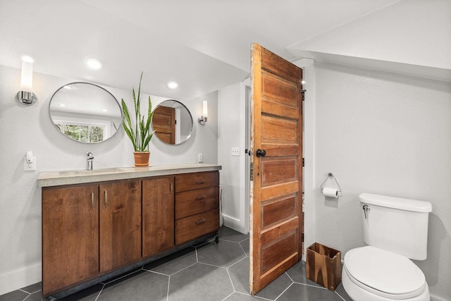 175 Old Wausau Rd, Stevens Point, WI 54481 - bathroom with toilet, vanity, tile patterned floors, and recessed lighting