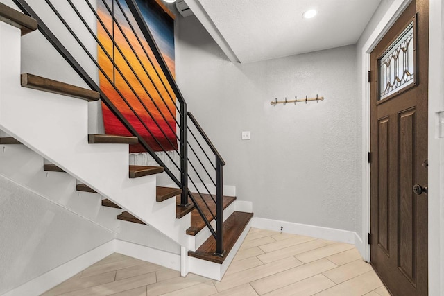 175 Old Wausau Rd, Stevens Point, WI 54481 - staircase featuring baseboards, recessed lighting, and wood finished floors