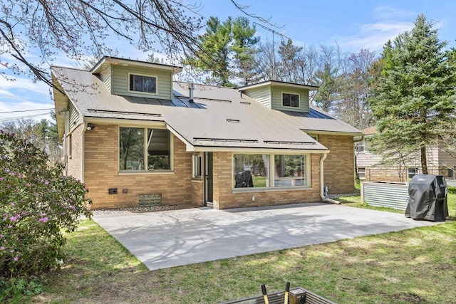 175 Old Wausau Rd, Stevens Point, WI 54481 - back of house featuring brick siding, a patio area, and a yard