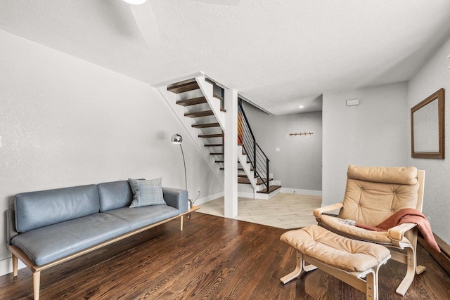 175 Old Wausau Rd, Stevens Point, WI 54481 - sitting room featuring stairs, wood finished floors, baseboards, and a ceiling fan