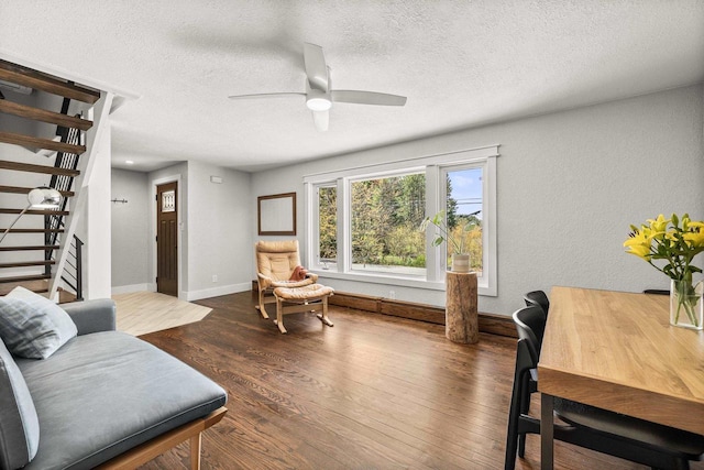 175 Old Wausau Rd, Stevens Point, WI 54481 - living room with stairway, wood finished floors, a textured ceiling, ceiling fan, and baseboards