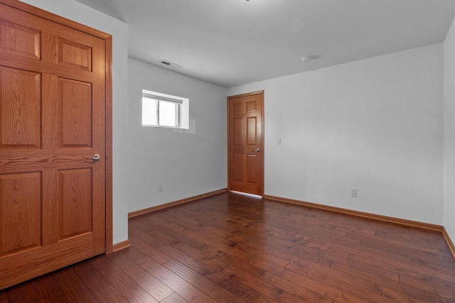 580 S Stone Ridge Dr, Lake Geneva, WI 53147 - unfurnished room featuring baseboards and dark wood finished floors