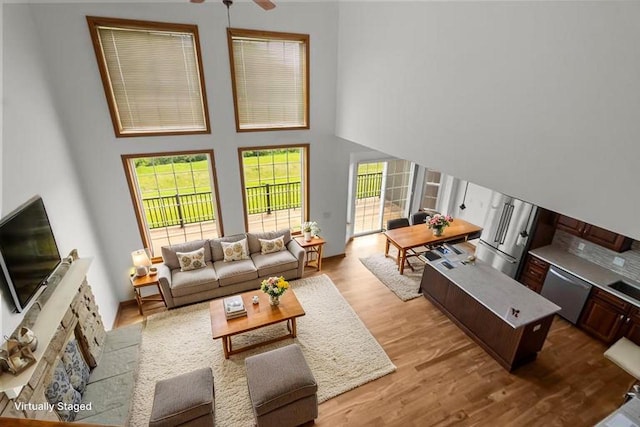 580 S Stone Ridge Dr, Lake Geneva, WI 53147 - living area with a high ceiling, wood finished floors, and ceiling fan