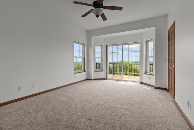 580 S Stone Ridge Dr, Lake Geneva, WI 53147 - unfurnished room with light carpet, baseboards, and a ceiling fan