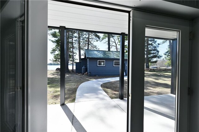 2097 Sunnyside Rd, Danbury, WI 54830 - doorway to outside with healthy amount of natural light and a water view