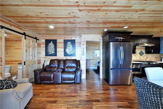 2097 Sunnyside Rd, Danbury, WI 54830 - living area featuring a barn door, wood ceiling, wood finished floors, recessed lighting, and wood walls