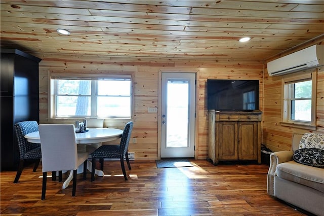 2097 Sunnyside Rd, Danbury, WI 54830 - dining room with a wall mounted air conditioner, wood ceiling, plenty of natural light, wood finished floors, and wood walls