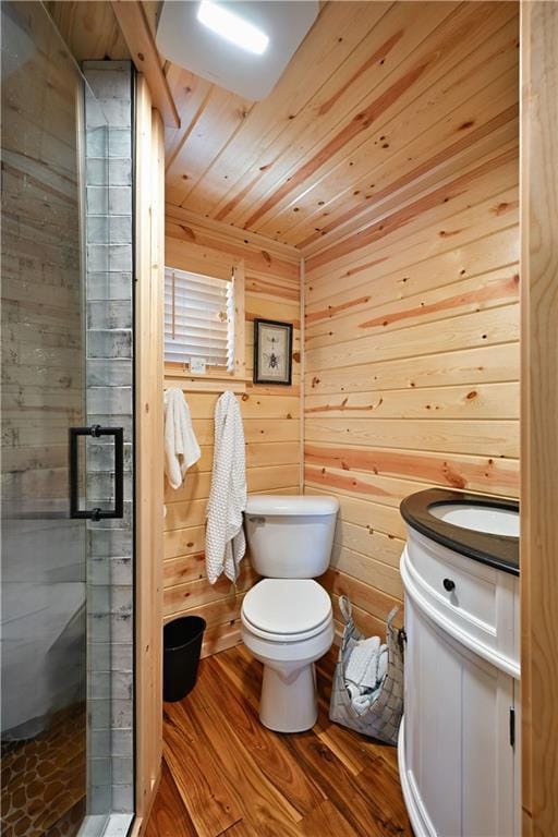 2097 Sunnyside Rd, Danbury, WI 54830 - full bathroom featuring toilet, a stall shower, wood finished floors, wood ceiling, and vanity
