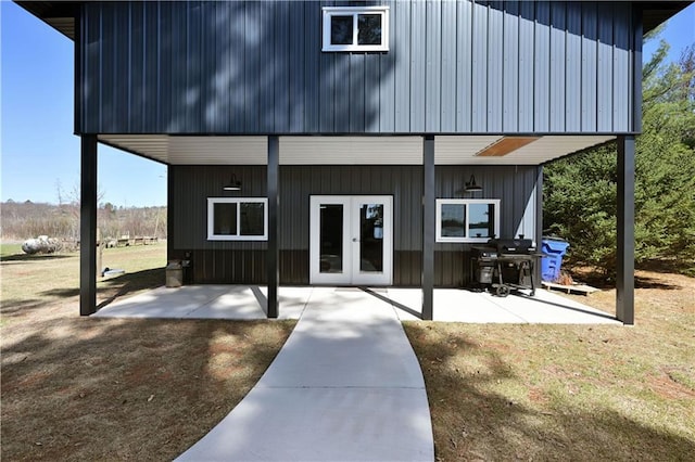 2097 Sunnyside Rd, Danbury, WI 54830 - doorway to property featuring french doors, a patio area, and board and batten siding