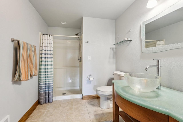 bathroom featuring a shower with shower curtain, baseboards, toilet, tile patterned floors, and vanity