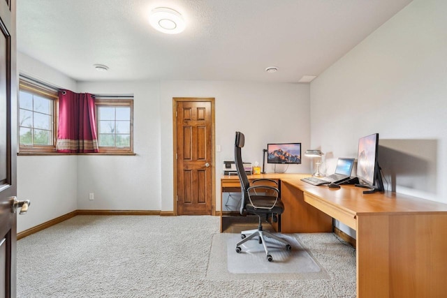 office area with baseboards and carpet floors