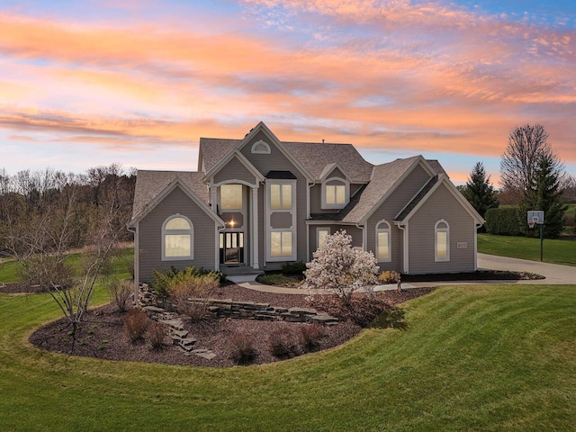 traditional home featuring a lawn