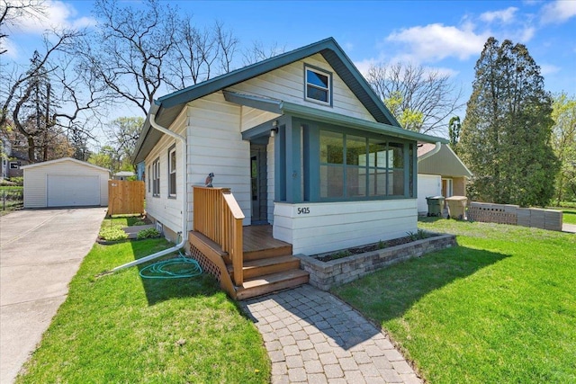 5425 Gettle Ave, Madison, WI 53705 - view of front of property with a detached garage and an outbuilding