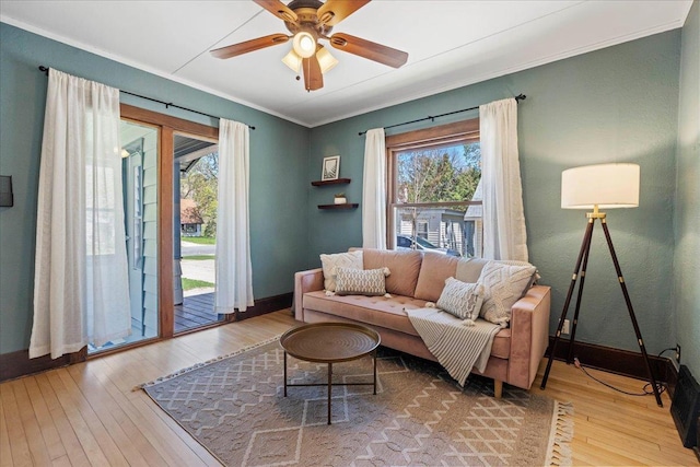 5425 Gettle Ave, Madison, WI 53705 - living room with wood-type flooring, baseboards, ornamental molding, and a ceiling fan
