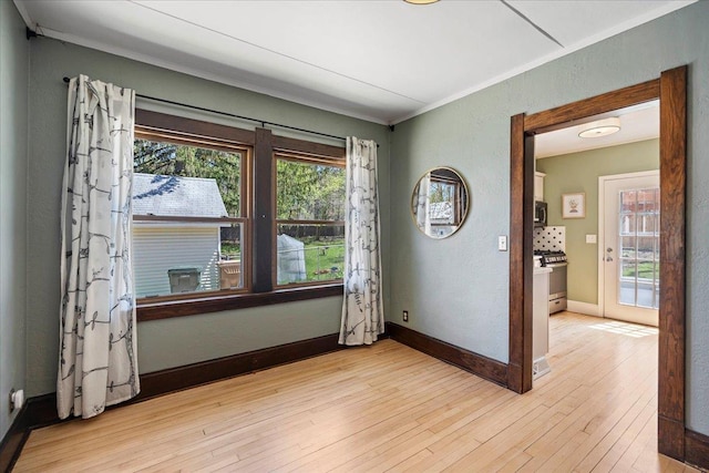 5425 Gettle Ave, Madison, WI 53705 - empty room with crown molding, light wood-style flooring, and baseboards