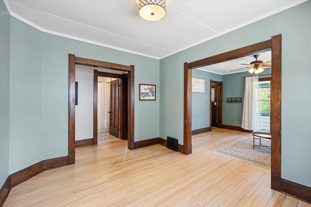 5425 Gettle Ave, Madison, WI 53705 - unfurnished room with ornamental molding, light wood-style floors, and baseboards