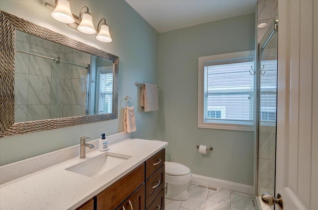 824 Richard Way, Waunakee, WI 53597 - bathroom featuring marble look tiles, toilet, tiled shower, and vanity