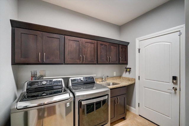 824 Richard Way, Waunakee, WI 53597 - laundry area featuring washing machine and clothes dryer, cabinet space, and light tile patterned flooring