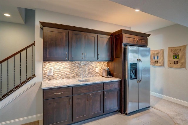 824 Richard Way, Waunakee, WI 53597 - kitchen featuring stainless steel fridge, a sink, tasteful backsplash, light stone countertops, and dark brown cabinetry