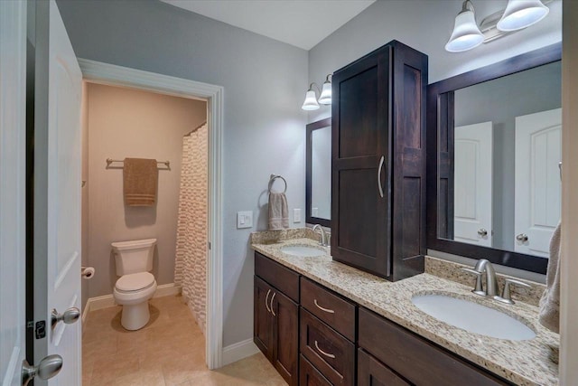 824 Richard Way, Waunakee, WI 53597 - full bath with double vanity, baseboards, tile patterned floors, and toilet