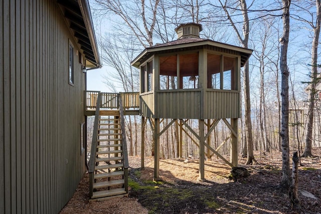 view of outdoor structure featuring a gazebo and stairs