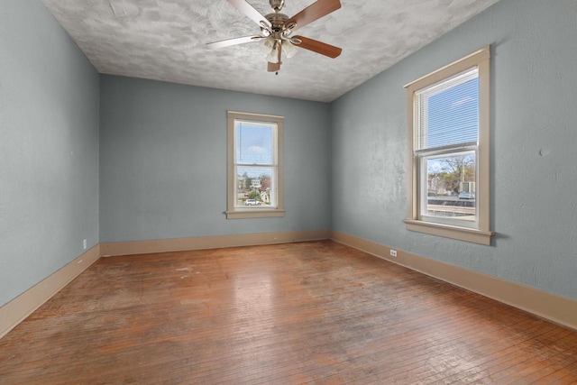 210 E Walworth St, Elkhorn, WI 53121 - unfurnished room featuring hardwood / wood-style flooring, ceiling fan, and baseboards