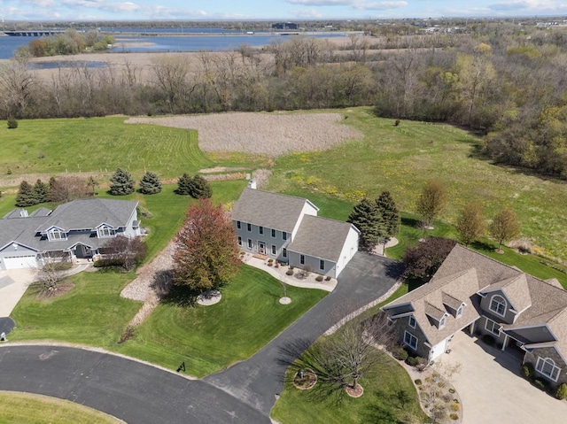 aerial overview of property's location featuring a large body of water and nearby suburban area
