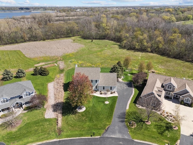 aerial view of property and surrounding area featuring a large body of water
