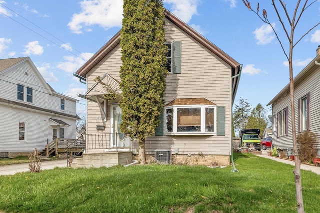 1214 S 17th St, Sheboygan, WI 53081 - view of front of home with a front yard and central AC