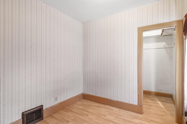 1214 S 17th St, Sheboygan, WI 53081 - laundry area with light wood finished floors and baseboards