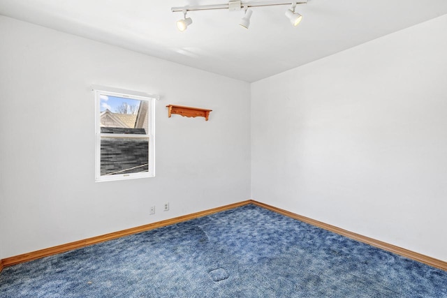 1214 S 17th St, Sheboygan, WI 53081 - empty room with rail lighting, carpet flooring, and baseboards