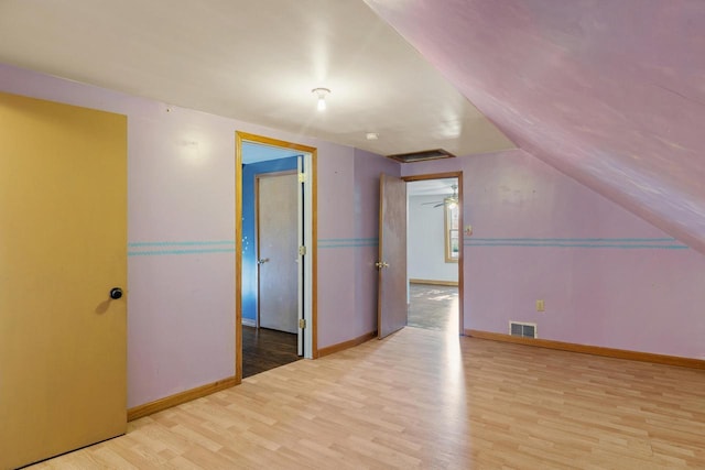 1214 S 17th St, Sheboygan, WI 53081 - additional living space with wood finished floors, baseboards, and lofted ceiling