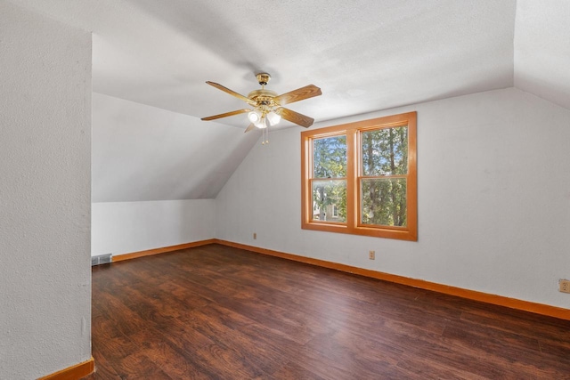 1214 S 17th St, Sheboygan, WI 53081 - additional living space with lofted ceiling, a ceiling fan, wood finished floors, and baseboards