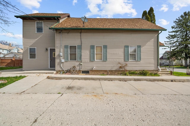 1214 S 17th St, Sheboygan, WI 53081 - back of property with fence and a shingled roof