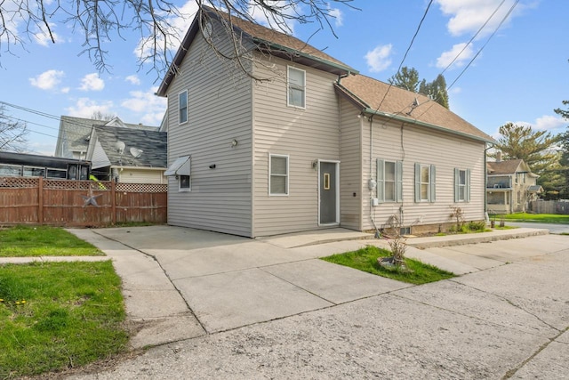 1214 S 17th St, Sheboygan, WI 53081 - back of house featuring fence and concrete driveway