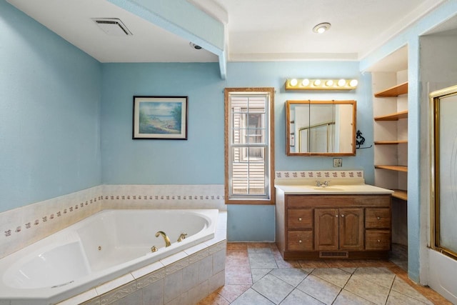 1214 S 17th St, Sheboygan, WI 53081 - full bath with a jetted tub, an enclosed shower, vanity, and tile patterned flooring