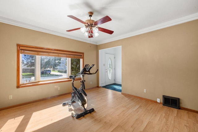 1214 S 17th St, Sheboygan, WI 53081 - exercise room featuring ceiling fan, baseboards, ornamental molding, and light wood-type flooring