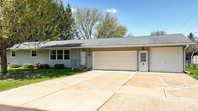 3710 Mcelroy St, Eau Claire, WI 54701 - ranch-style home featuring a garage, a front yard, and concrete driveway