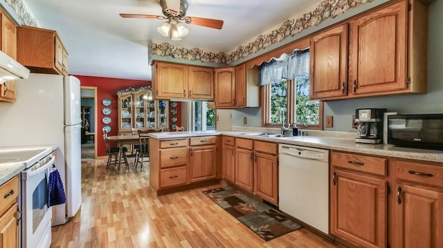3710 Mcelroy St, Eau Claire, WI 54701 - kitchen with white appliances, a sink, light wood finished floors, and light countertops